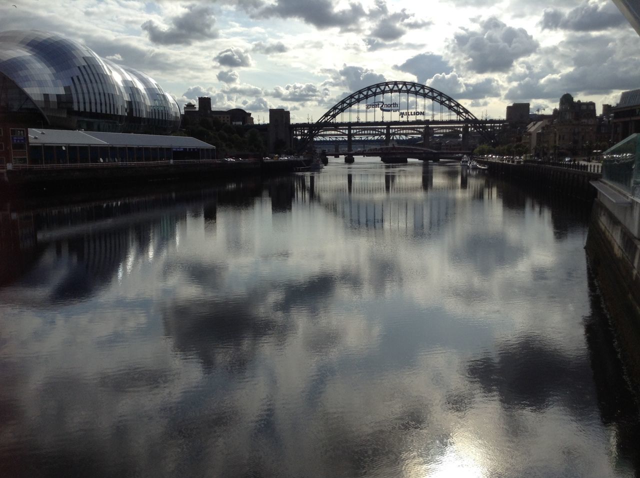 VIEW OF BRIDGE OVER RIVER IN CITY