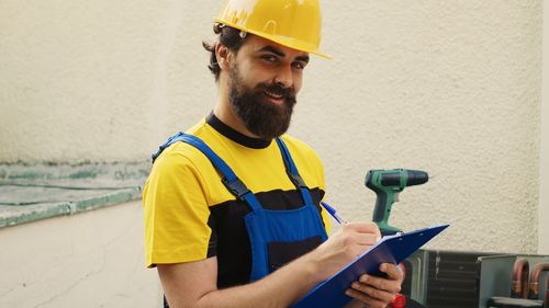 Portrait of man working in factory