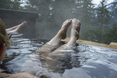 Cropped image of woman in hot spring