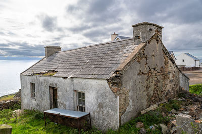 Old building against cloudy sky