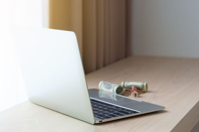 Close-up of laptop on table at home