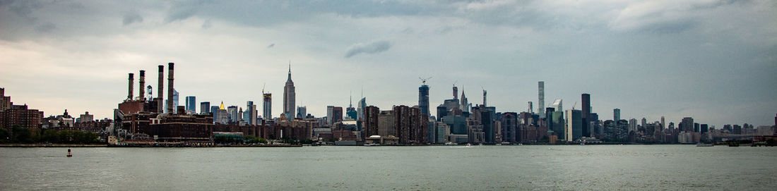 Modern buildings in city against sky