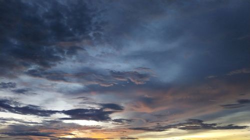 Low angle view of dramatic sky during sunset