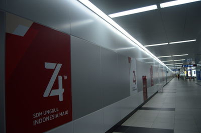 Information sign on wall at subway station