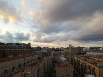 High angle view of buildings against sky at sunset