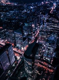 High angle view of illuminated buildings in city at night