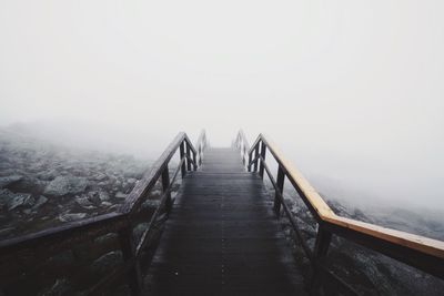 Boardwalk against clear sky