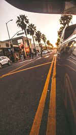 Cars on street against sky