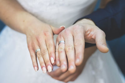 Close-up of couple holding hands