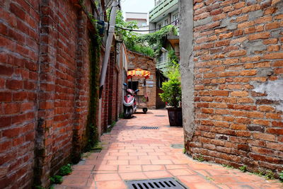 Alley amidst buildings in city