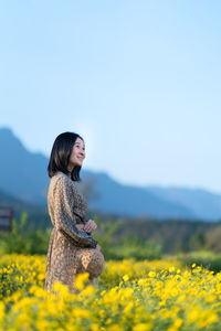 Woman standing on field