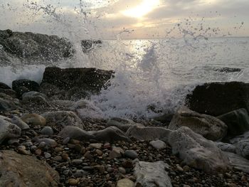 Full frame shot of beach against sky during sunset