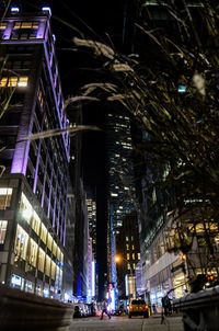 Illuminated city street at night