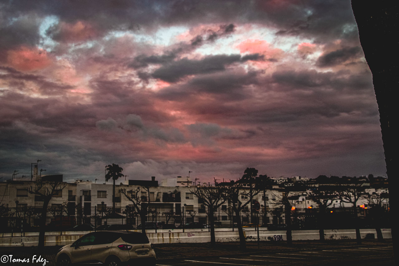 BUILDINGS AGAINST DRAMATIC SKY