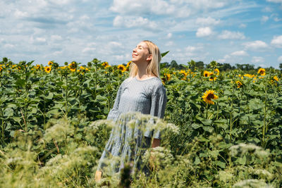 Ukrainian girl young woman on the background of sunflowers field. ukraine sunflowers national