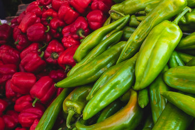 Full frame shot of green chili peppers for sale at market stall