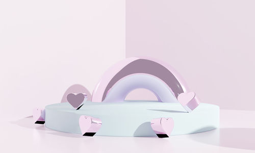 Close-up of colored pencils on table against white background