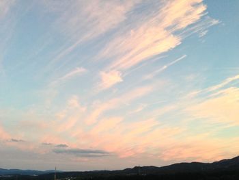 Scenic view of landscape against sky at sunset