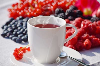 Close-up of strawberries and coffee on table