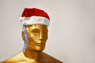Close-up of statue against white background
