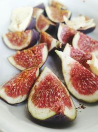 High angle view of chopped fruits in plate on table