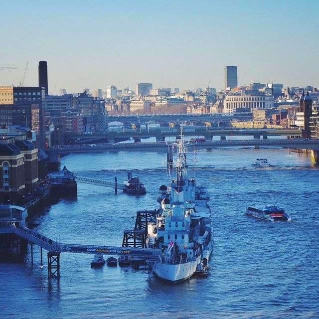 nautical vessel, transportation, boat, water, mode of transport, waterfront, building exterior, architecture, built structure, moored, sea, city, clear sky, river, sailing, copy space, harbor, travel, sky, cityscape