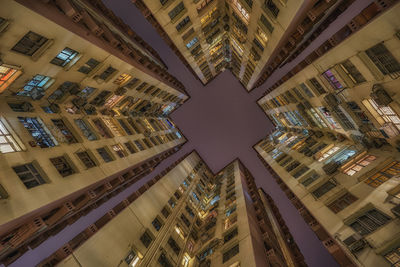 Directly below shot of buildings against sky