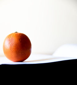 Close-up of orange fruit on table