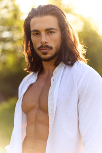 Portrait of young man standing outdoors