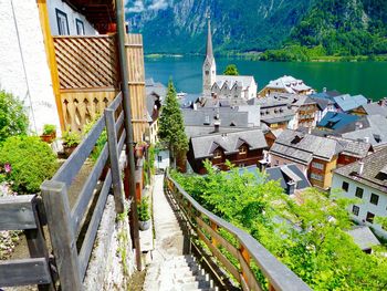 Houses in town at lakeshore by mountain