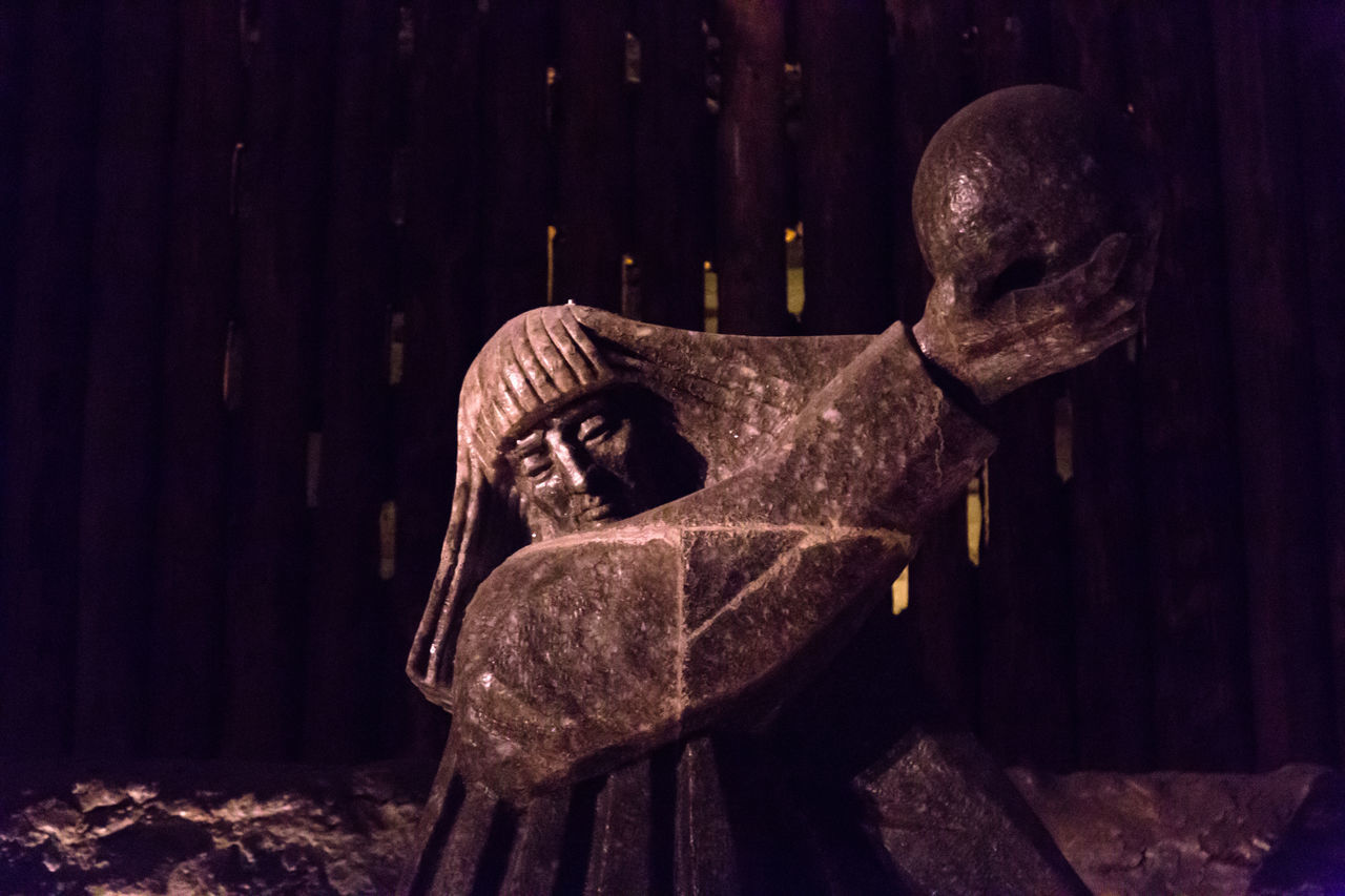 CLOSE-UP OF ANGEL STATUE AGAINST TREE