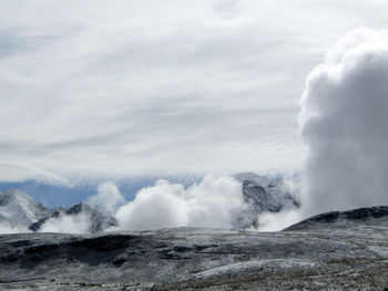 Scenic view of volcanic mountain against sky