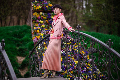 Portrait of girl standing on plants