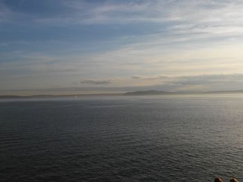 Scenic view of sea against cloudy sky