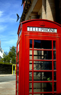 Close-up of red balloons against sky