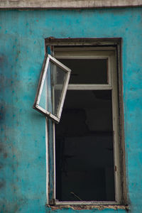 Closed window of abandoned house