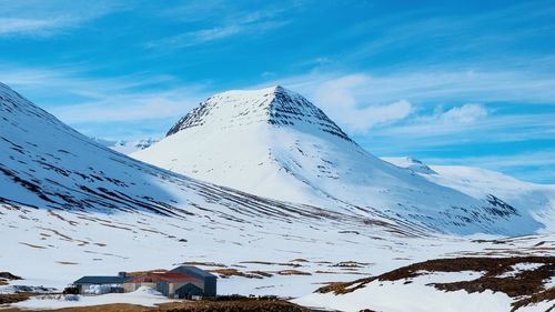 Scenic view of snowcapped mountains against sky