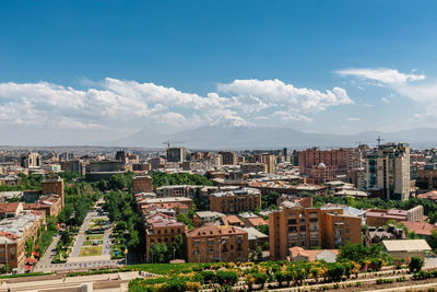 Aerial view of townscape against sky