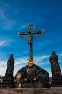 Statue against blue sky