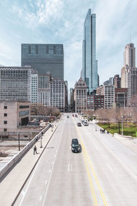 City street and modern buildings against sky