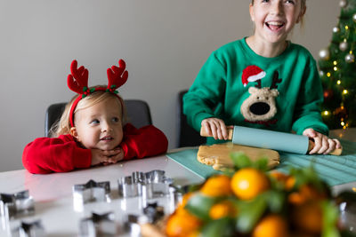 Portrait of cute girl playing with toys at home