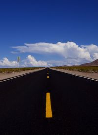 Country road against blue sky