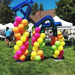 Multi colored balloons on tree