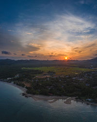 Scenic view of river against sky during sunset