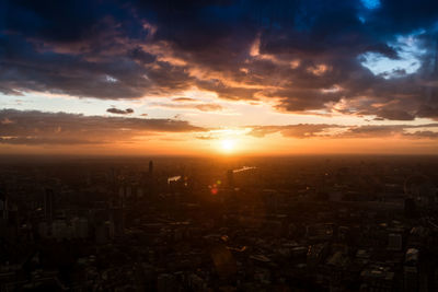 Aerial view of city at sunset