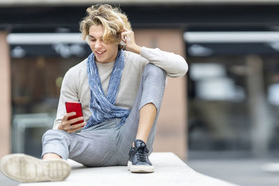 Mid adult woman using mobile phone