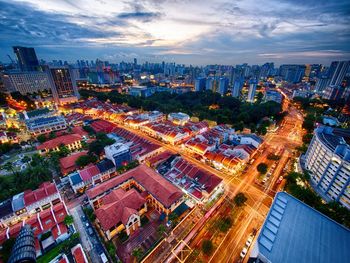 High angle view of illuminated cityscape against sky