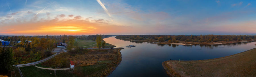 Panoramic view of river against sky during sunset