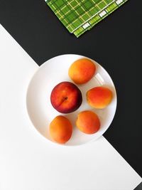 High angle view of fruits in plate on table