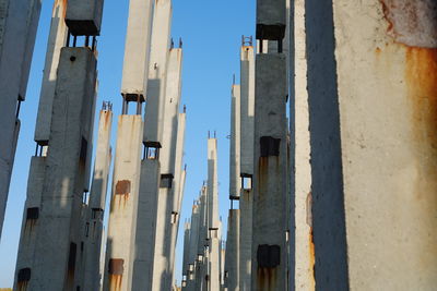 Low angle view of buildings against clear blue sky